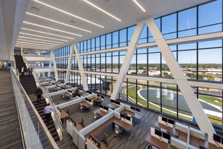 Inside Zurich American Insurance Company’s headquarters at 90 North Schaumburg, featuring an open-concept design with expansive glass walls and scenic views of the campus.