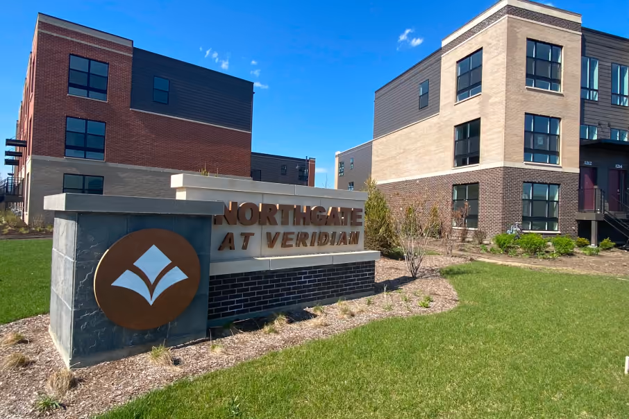 Northgate at Veridian Condos in 90 North Schaumburg, showcases modern residential design with brick accents and green spaces