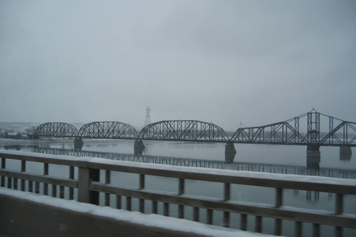 The highway bridge over the Missouri River at Pierre, South Dakota, seen from the bank.