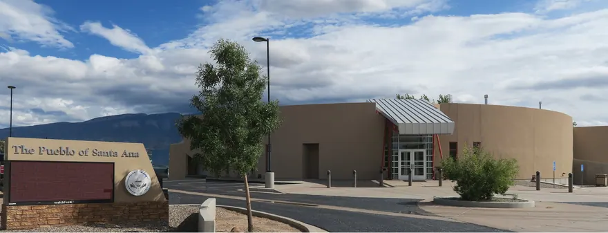 The Pueblo of Santa Ana administration building, with its name on a stone sign in front.