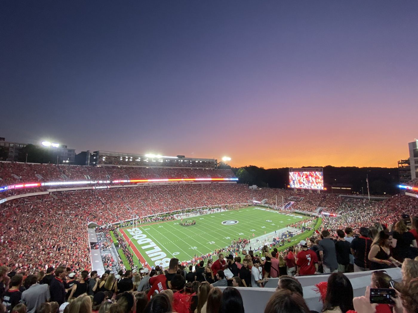 Sanford Stadium full of fans on a game day, the field framed by the famous hedges