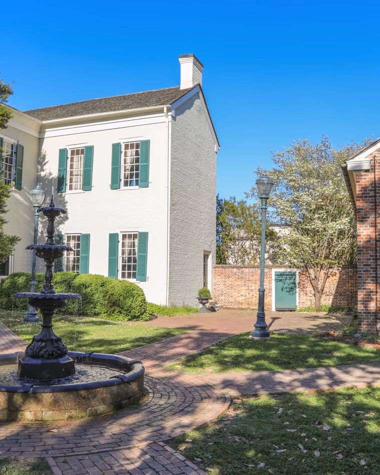 The courtyard fountain between the President James K. Polk Home and the brick Polk Sisters' House.