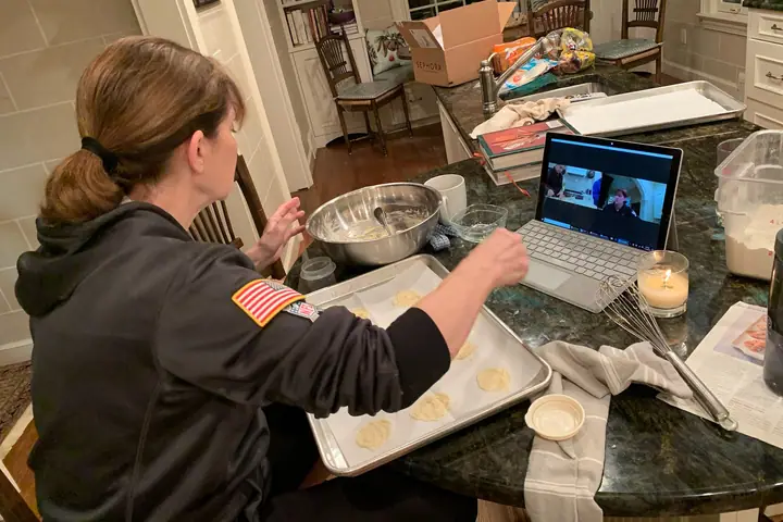 Jaclyn's mother teaching family how to cook appetizers over a Zoom video call