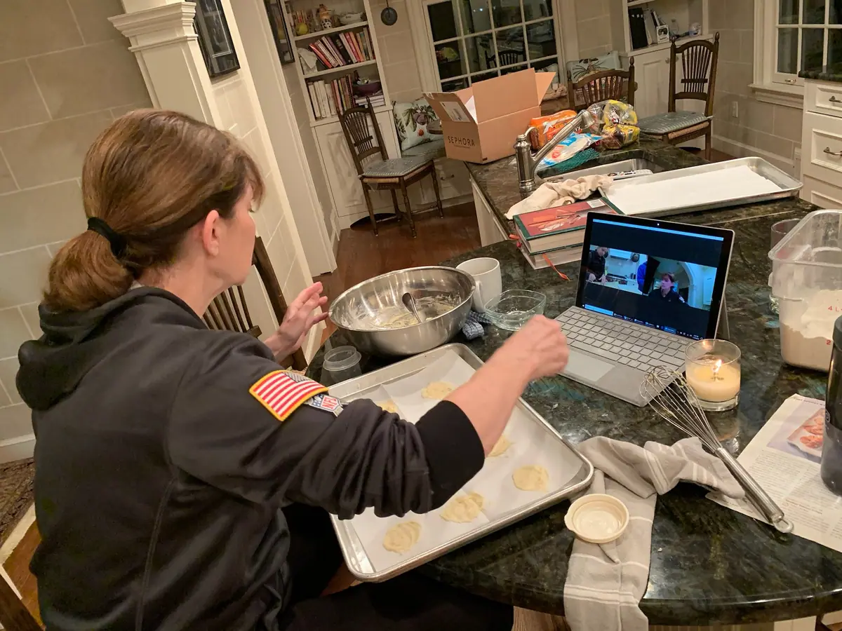 Jaclyn's mother teaching family how to cook appetizers over a Zoom video call