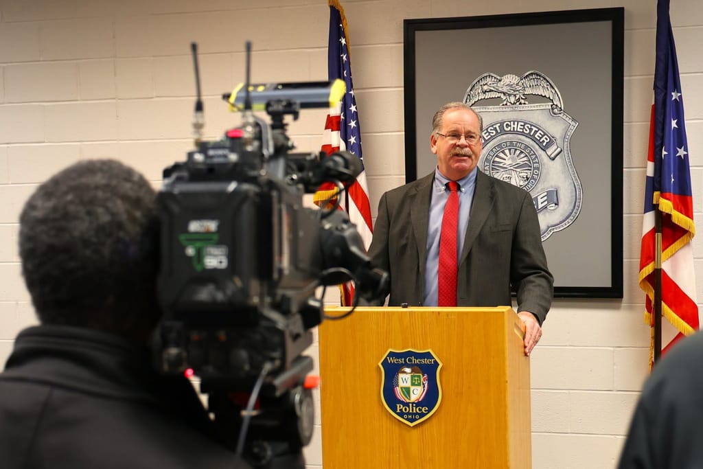 Lt. David Tivin speaks to reporters at a police news conference.