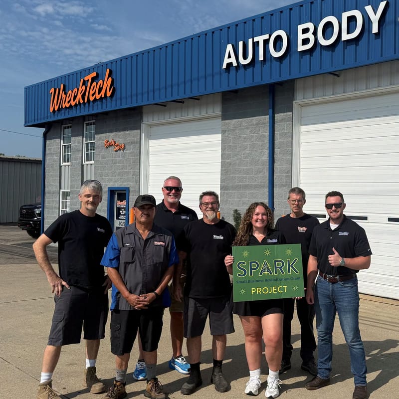 The WreckTech Auto Body team outside their shop on Princeton Glendale Road after a Spark Grant project.